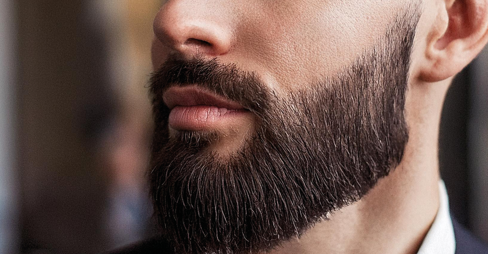 uomo con barba definita e lunga